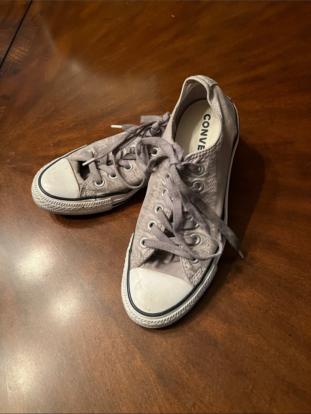 Converse Women’s Low Top Canvas Sneakers in a satin Gray material